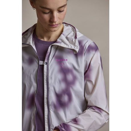 Front view of button detail Maloja women's AlarisM running jacket in shaded white shadow colour