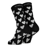 Maloja's ResinaM. socks in deep black colour with white hearts