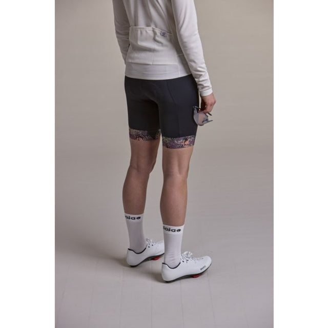 Side view of model wearing the Maloja SundaM cycle tights for wome in deep black colour