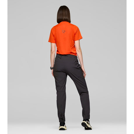 Back on-model view of Norrona Senja Flex1 Trackster pants for women in caviar black colour