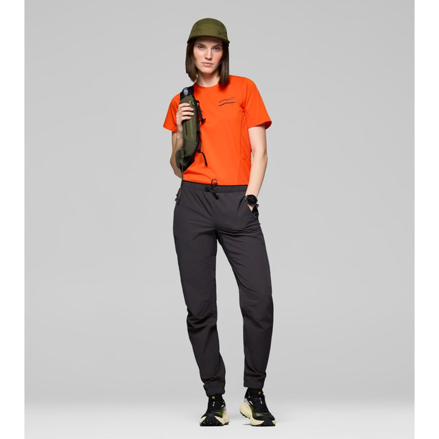 Front on-model view of Norrona Senja Flex1 Trackster pants for women in caviar black colour