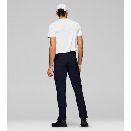 Back on-model view of Norrona femund Flex1 lightweight pants men's in caviar black colour