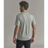 Back on-model view of Ortovox 150 cool beanie T-shirt men's in green sage colour