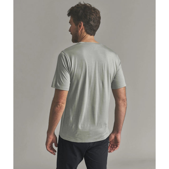 Back on-model view of Ortovox 150 cool beanie T-shirt men's in green sage colour