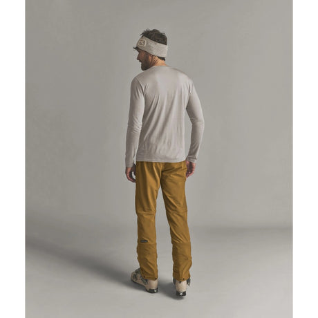 Back on-model view of Ortovox Ortler Softshell pants men's in dark cumin colour