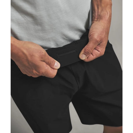 Waistband detail on-model view of Ortovox men's Trace shorts in black raven colour
