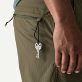 Back pocket detail on-model view of Patagonia baggies lights 6" men's in basin green colour