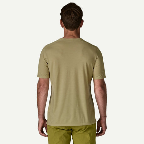 Back view on-model of Patagonia's men's Capilene cool trail shirt in weathered stone