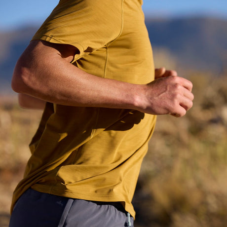 Lifestyle on-model view of Patagonia Capilene Cool Ultra Shirt men's in Bobcat Brown x-dye colour
