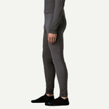 Side on-model view of Patagonia's Men Capilene Lightweight Bottoms in black colour
