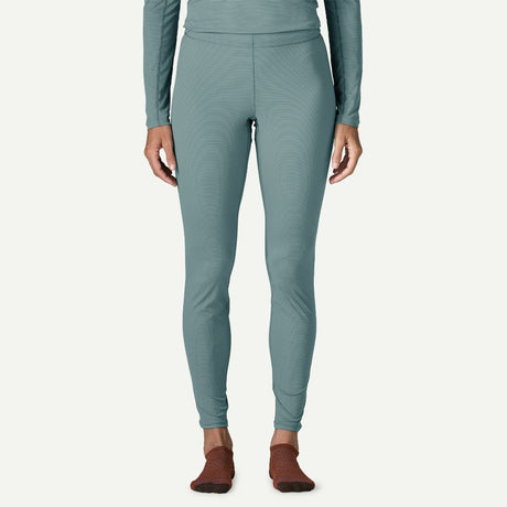 Front on-model view of Patagonia's Women Capilene Lightweight Bottoms in bluea sage colour