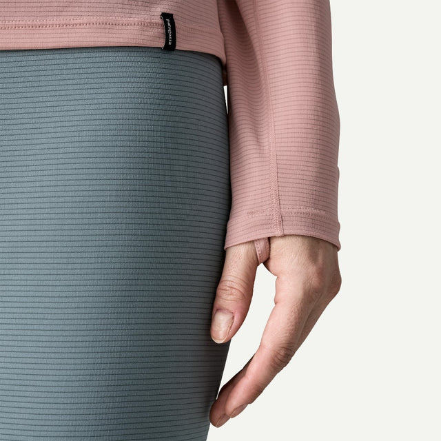 Thumb-loops on-model view of Patagonia Capilene Lightweight Crewneck Women's in fuzzy mauve colour