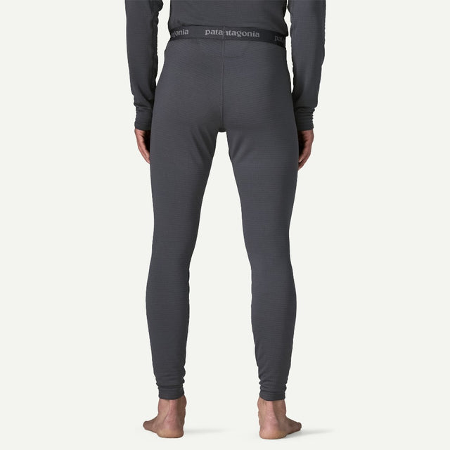 Back on-model view of Patagonia's Men Capilene Thermal weight Bottoms in Smolder blue colour
