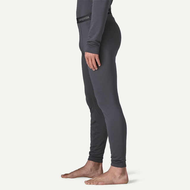 Side on-model view of Patagonia's Men Capilene Thermal weight Bottoms in Smolder blue colour
