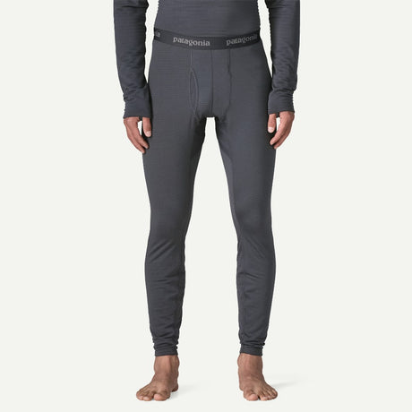 Front on-model view of Patagonia's Men Capilene Thermal weight Bottoms in Smolder blue colour