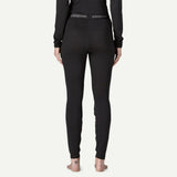 Back on-model view of Patagonia's capilene thermal weight bottoms women's in black colour