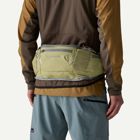 Back on-model view of Patagonia Dirt Roamer Waist pack in gumtree green