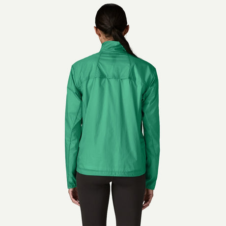 Back on-model view of Patagonia Houdini stash 1/2 zip pullover women's in aqua stone colour