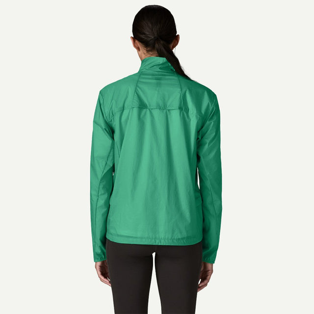 Back on-model view of Patagonia Houdini stash 1/2 zip pullover women's in aqua stone colour