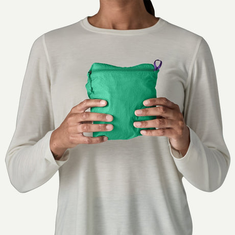 Packed view of Patagonia Houdini stash 1/2 zip pullover women's in aqua stone colour