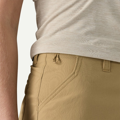Pocket detail on-model view of Patagonia quandary 5" shorts women's in classic tan colour