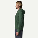 Side on-model view of Patagonia Men's R1 TechFace Hoody in Canopy Green colour