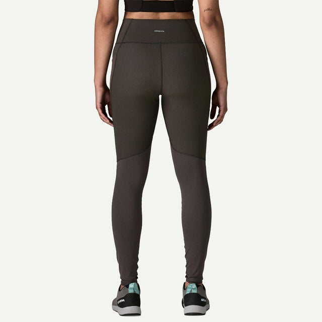 Back view on-model of Patagonia's women's terravia peak tights in black colour