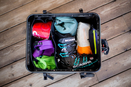 Open RUX gear box with ski gear packed inside