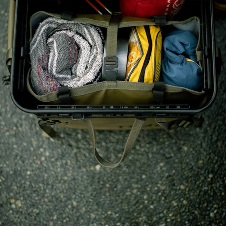 Packed green RUX tote bag inside a RUX gear box