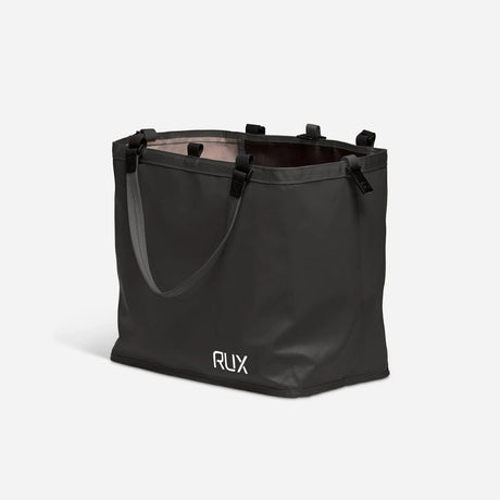 Side angled view of black RUX tote bag