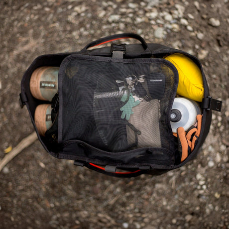 Black RUX tote bag packed with bike gear