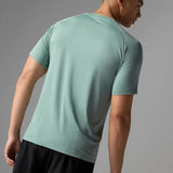 Back on-model view of rabbit men's EZ tee perf ICE short sleeve in iceberg green colour