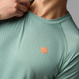 Front on-model detail view of rabbit men's EZ tee perf ICE short sleeve in iceberg green colour