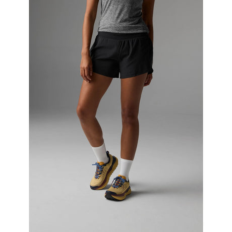 Front view on-model of Rabbit FKT 4" women's short in black colour