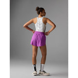 Back on-model view of Rabbit float n' fly shorts for women in purple cactus flower colour
