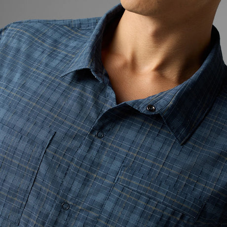 On-model view of collar detail of rabbit High Country SS Men's shirt in dress blue plaid colour