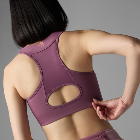 Back on-model view of Rabbit's hydration trail bra women's in hawthorn rose colour