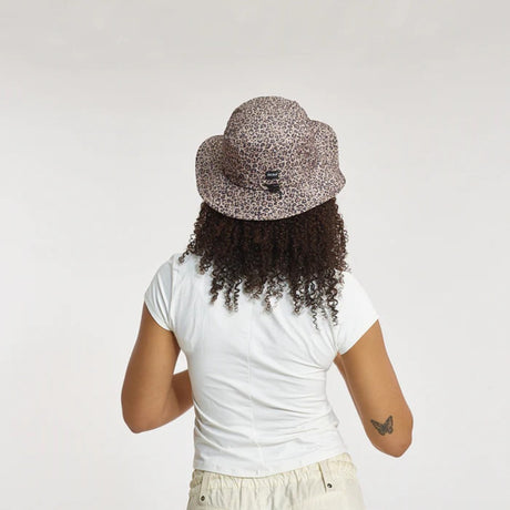 Back view of model in Skida Sun Hat in Wild Thing colour