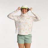 Front view of model in Skida sun shirt in elysian field colour