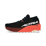 Side view of women's Altra Olympus 275 running shoe in coral/black