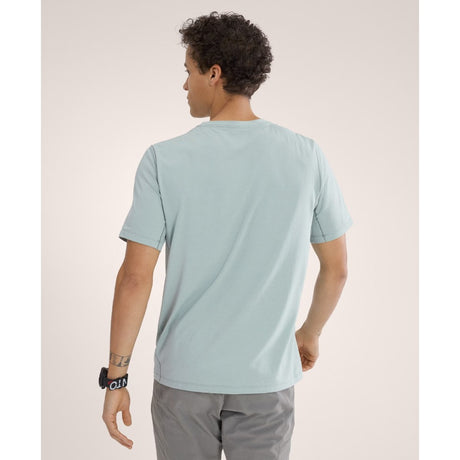 Back on-model view of men's Arct'eryx Cormac Logo SS Shirt in stone green heather colour
