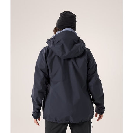 Back on-model view of women's Arc'teryx Beta AR Jacket in black sapphire colour (navy)