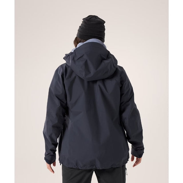 Back on-model view of women's Arc'teryx Beta AR Jacket in black sapphire colour (navy)