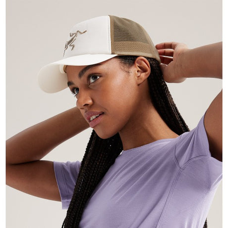 Side view of Arc'teryx Bird Trucker curved brim hat in arctic silk/canvas colour