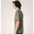 Side on-model view of men's forage heather (green) Arc'teryx Cormac t-shirt