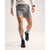 Front on-model view of men's Arc'teryx Norvan 5" running shorts in void (gray)