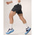 Side on-model view of men's black Arc'teryx Norvan 7" running shorts