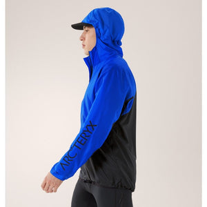 Side on-model view of men's Arc'teryx Norvan Windshell hoody in vitality/black sapphire colour