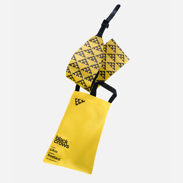 Rolled up yellow/black Black Crows touring skin with carry bag