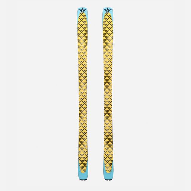 Pair of yellow/black Black Crows touring skins on a pair of skis